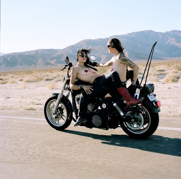 Girls on a motorcycle in Kum