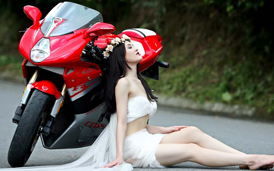 Beautiful girls and motorcycles in Kum